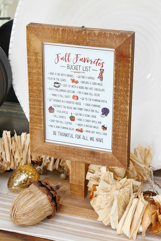 Fall favorites fall bucket list displayed in a wood frame.