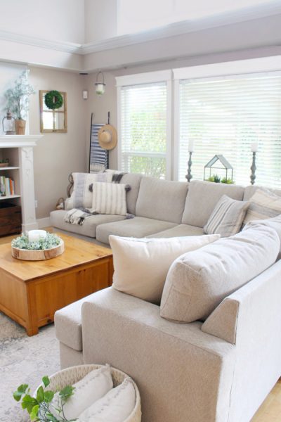 Beige sectional in a modern farmhouse style family room.