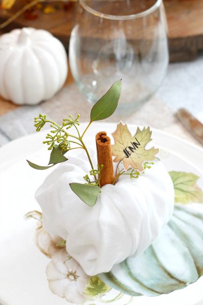 Cute napkin fold pumpkins for Thanksgiving place settings.