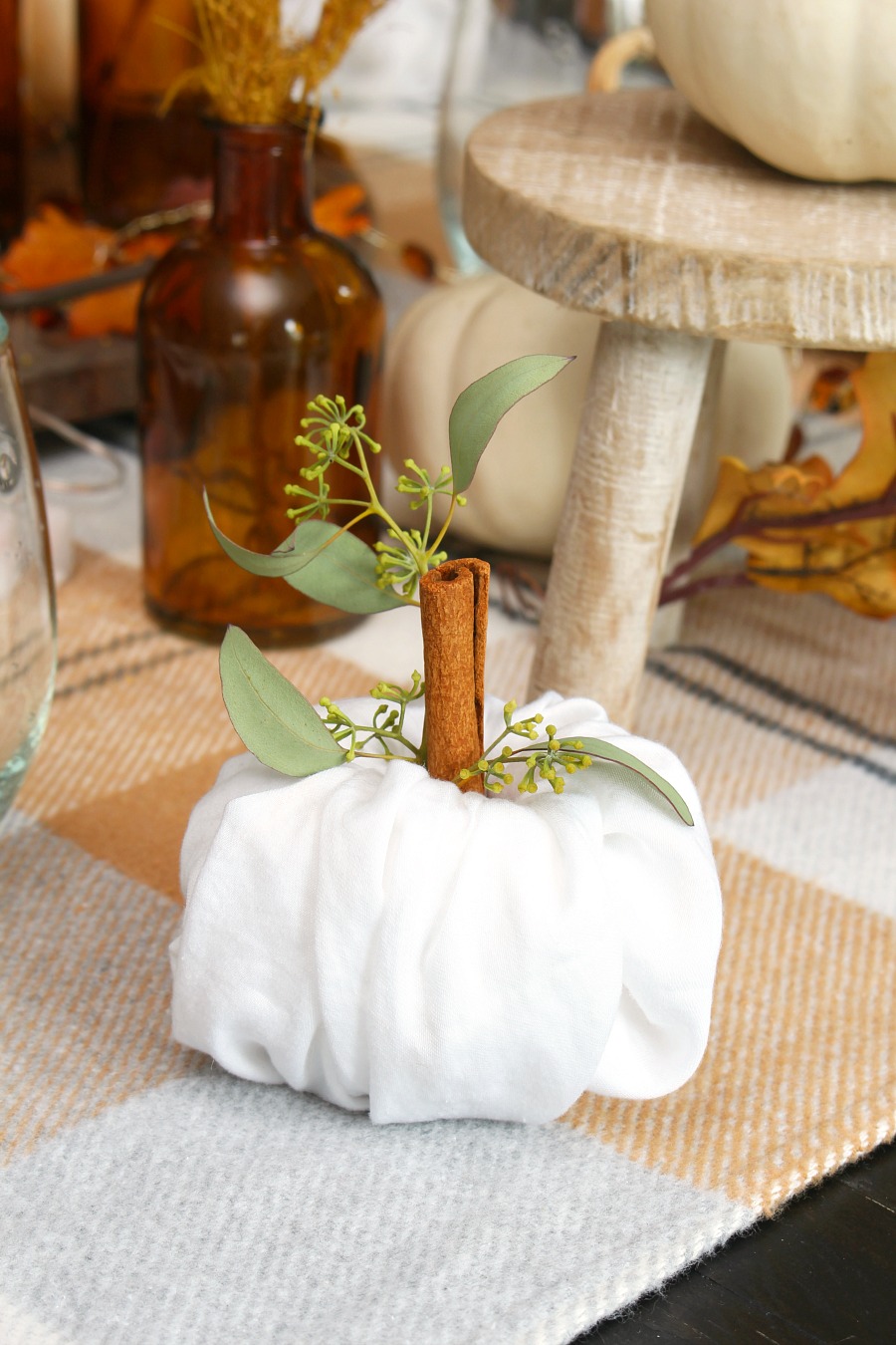 Cute napkin fold pumpkins for Thanksgiving place settings.