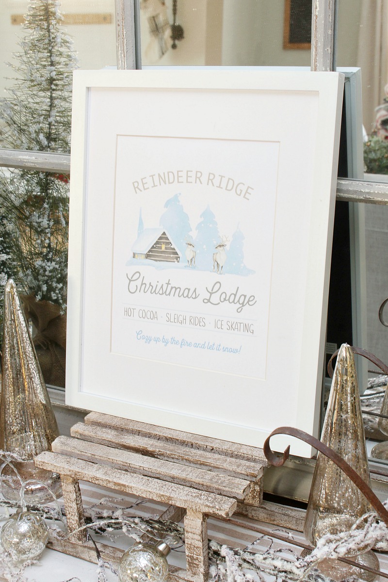 Reindeer Ridge Christmas Lodge free Christmas printable on a wood sled.