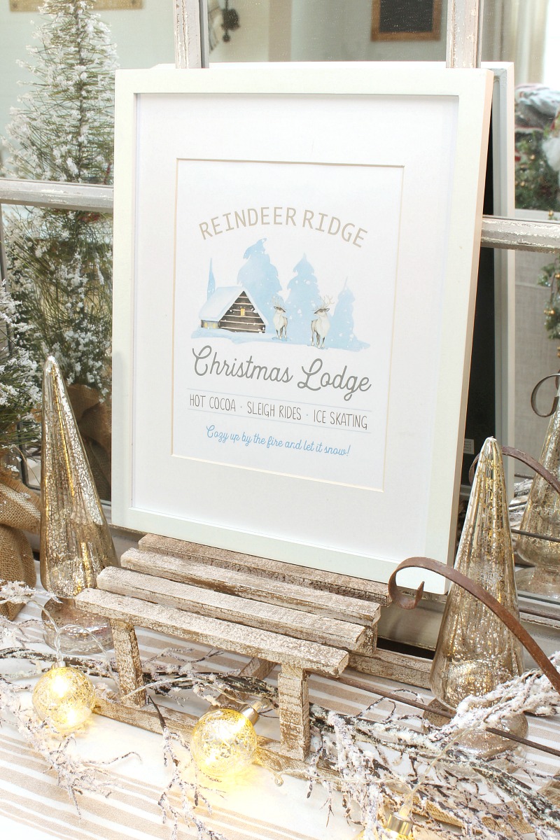 Reindeer Ridge Christmas Lodge free Christmas printable on a wood sled.