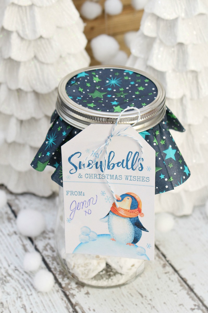 Snowball Christmas cookies in a mason jar with tag.