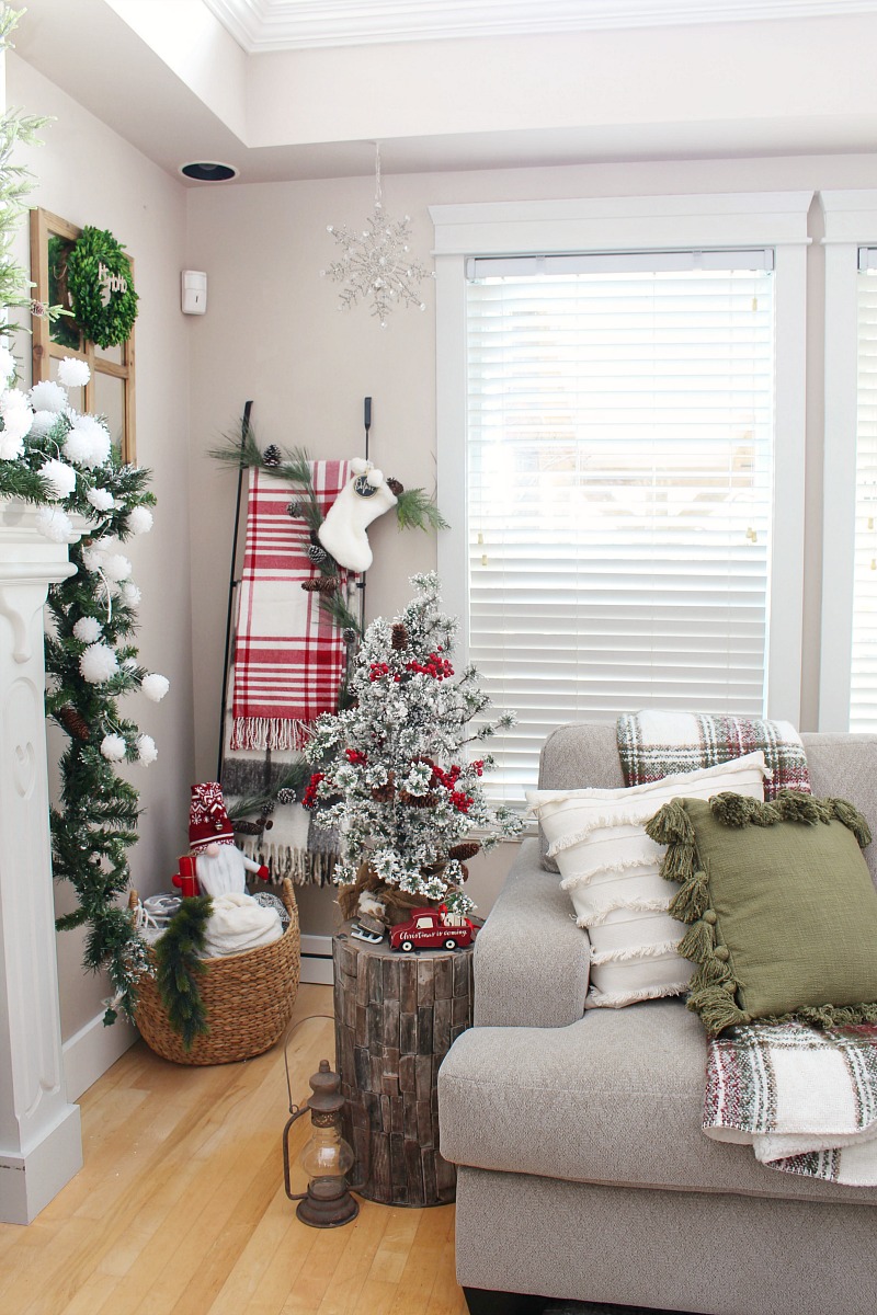 Farmhouse style family room Christmas decor with blanket ladder.