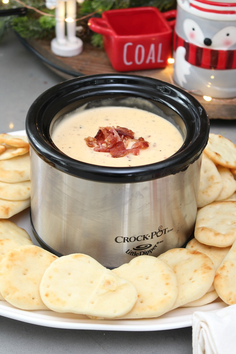 Swiss cheese, bacon, and beer dip in a mini crock pot.