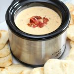Swiss cheese, bacon, and beer dip in a mini crock pot.