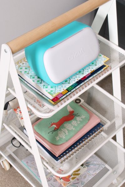 Cricut Joy smart cutting machine on a craft cart.