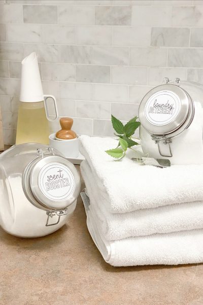 Glass laundry containers with DIY laundry labels.