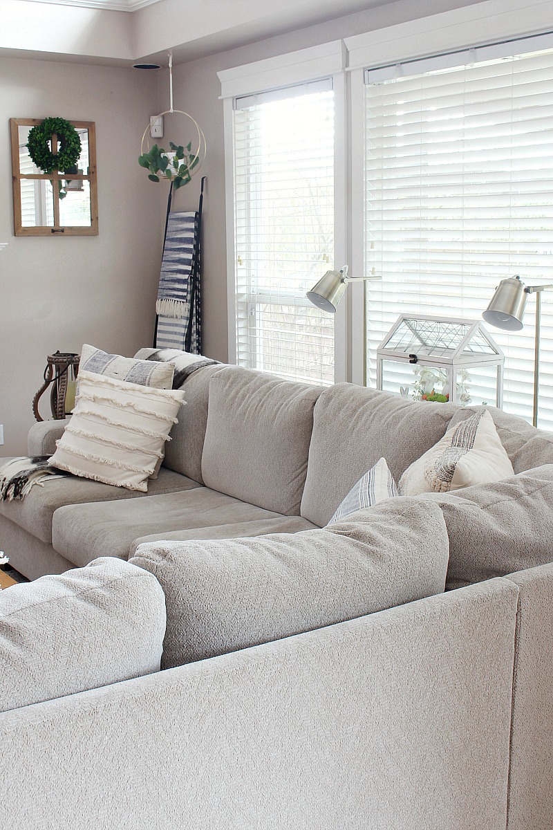 Sectional sofa in a family room decorated for spring.