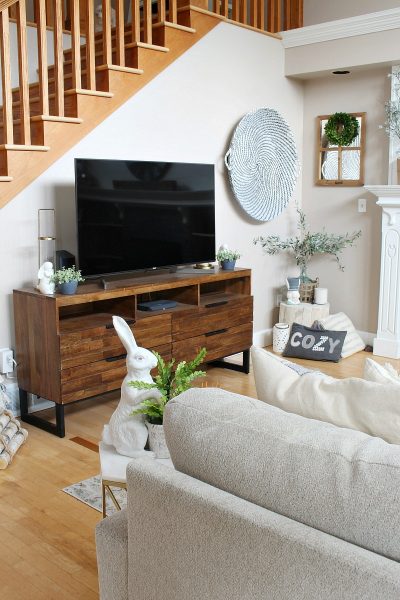 Transitional style family room with television console. #familyroom #familyroomdecor #televisionstand #springdeecor