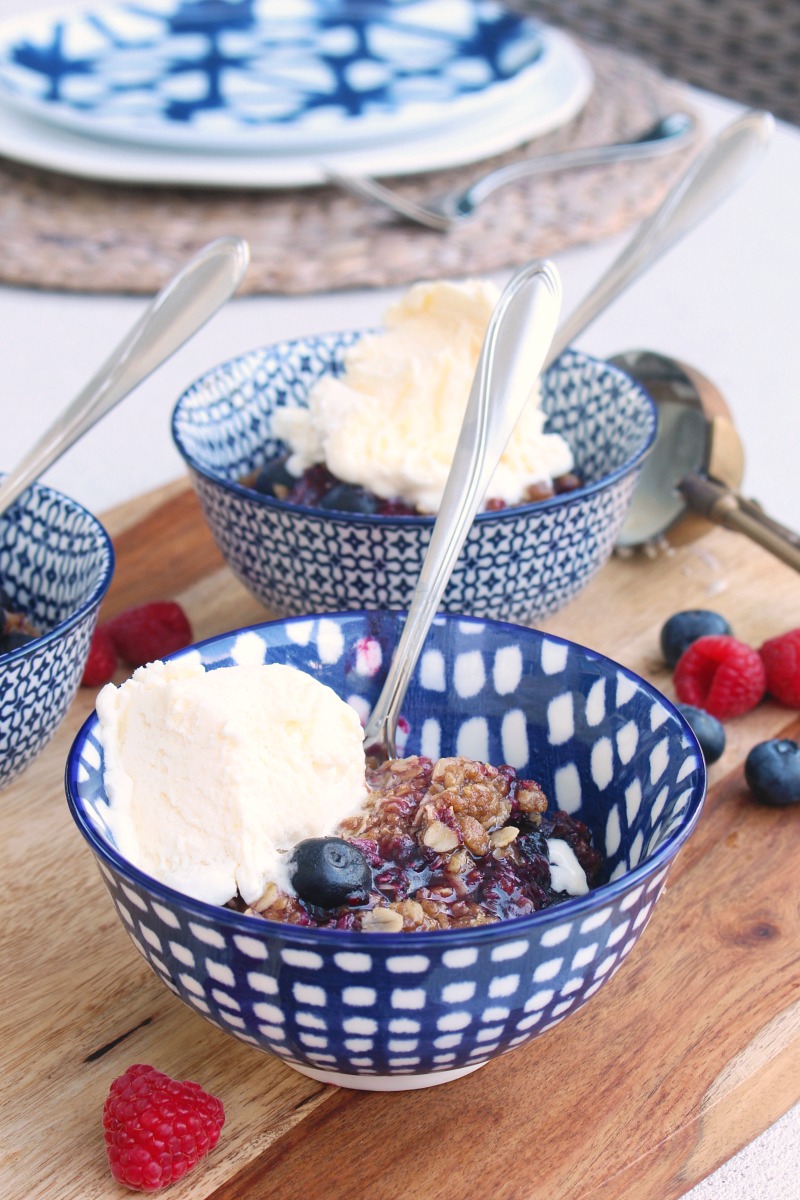 Berry crumble in blue bowls.
