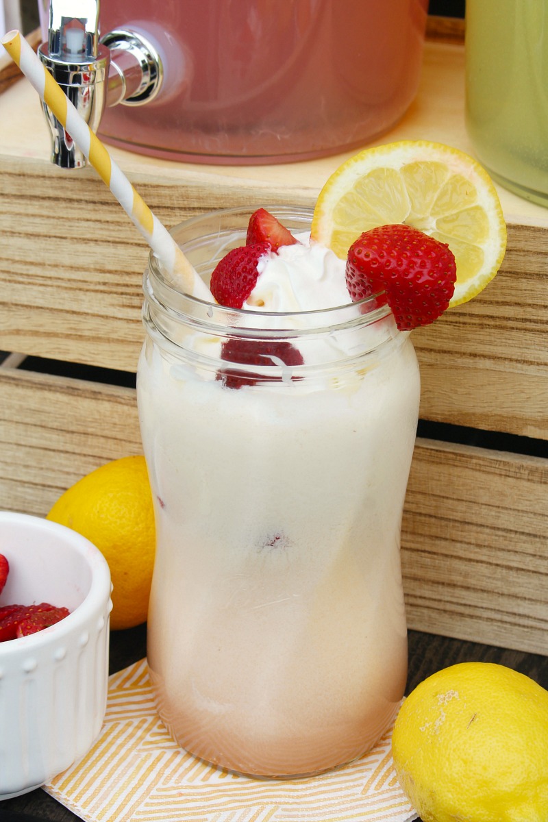 Strawberry lemonade float with fresh strawberries and lemonades.