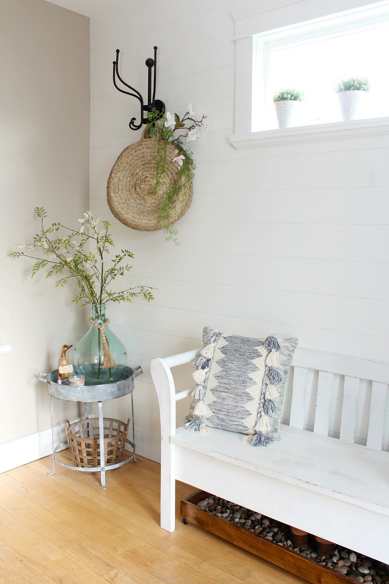 Light and airy front entry way decorated for summer.
