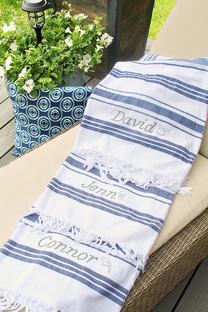 Blue and white striped towels with DIY custom name using iron-on vinyl.