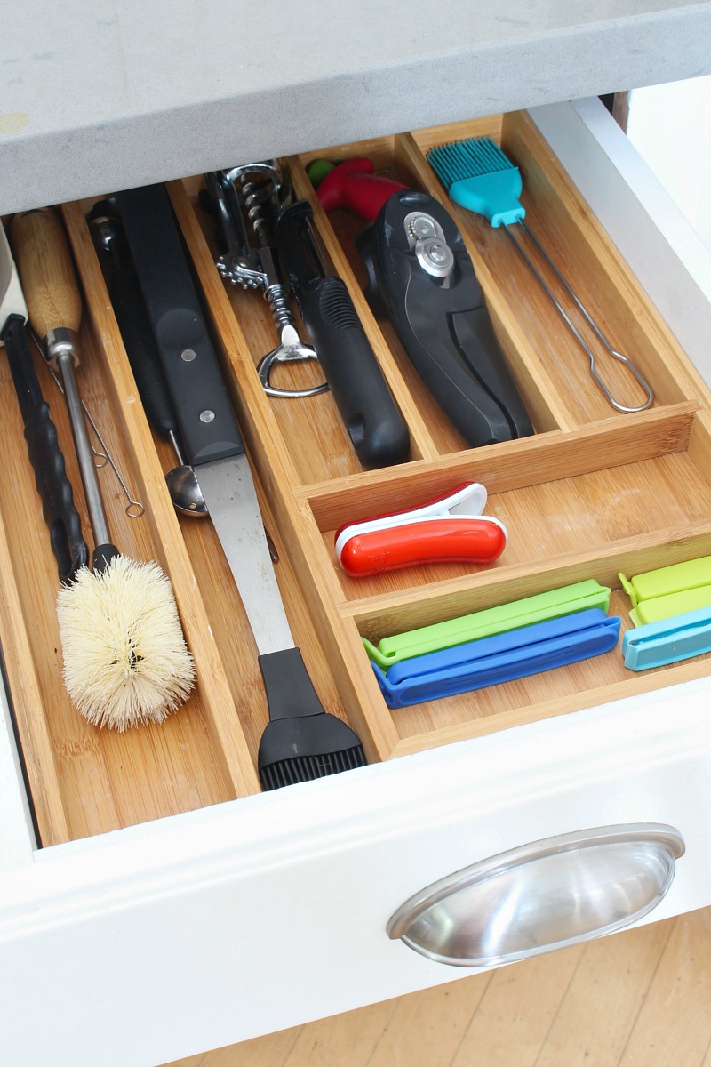 Organized kitchen drawer with drawer divider tray.