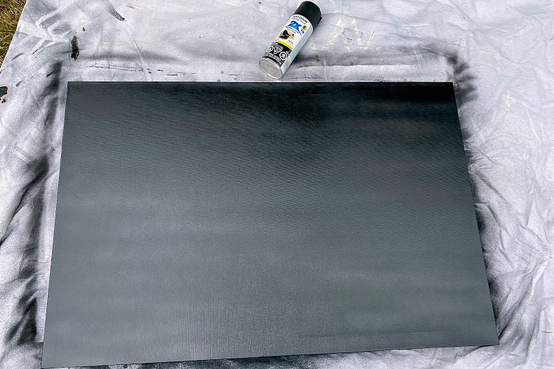 Fall sign tutorial spray painting a canvas black.