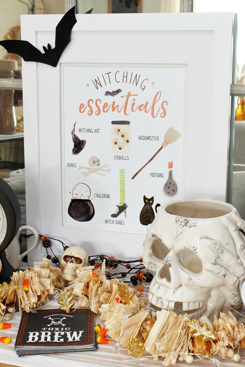 Witching Essentials free Halloween printable with Halloween decorations.