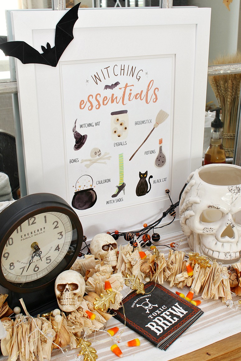 Witching Essentials free Halloween printable with Halloween decorations.