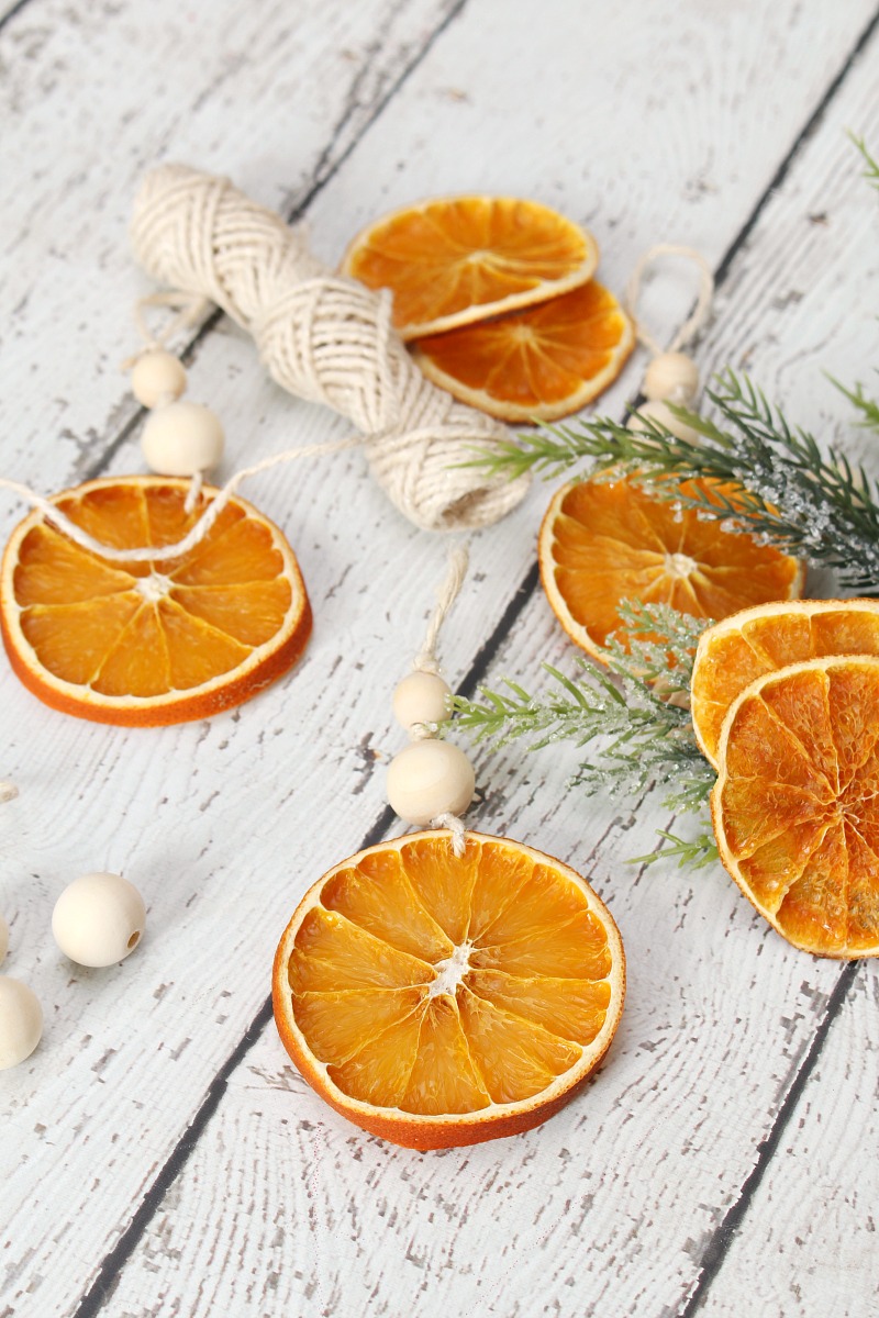 DIY dried orange Christmas ornaments with wood beads.