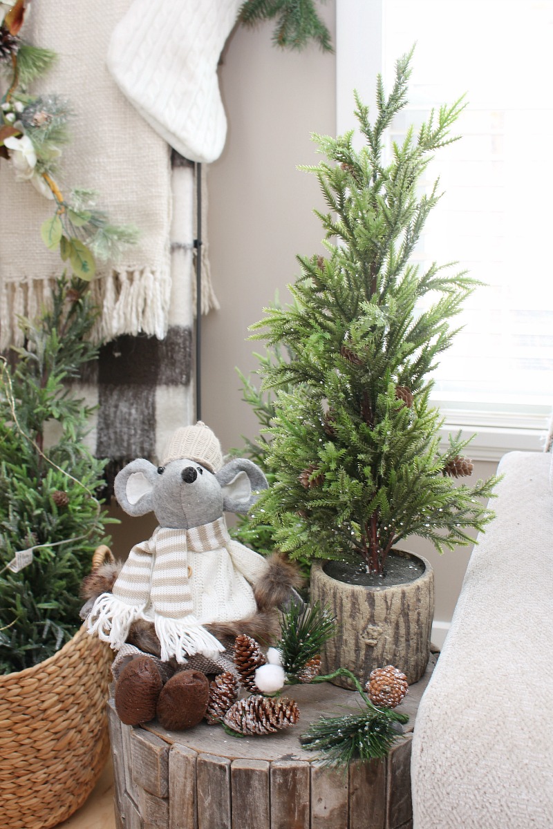 Christmas vignette with Christmas mouse by a Christmas tree.