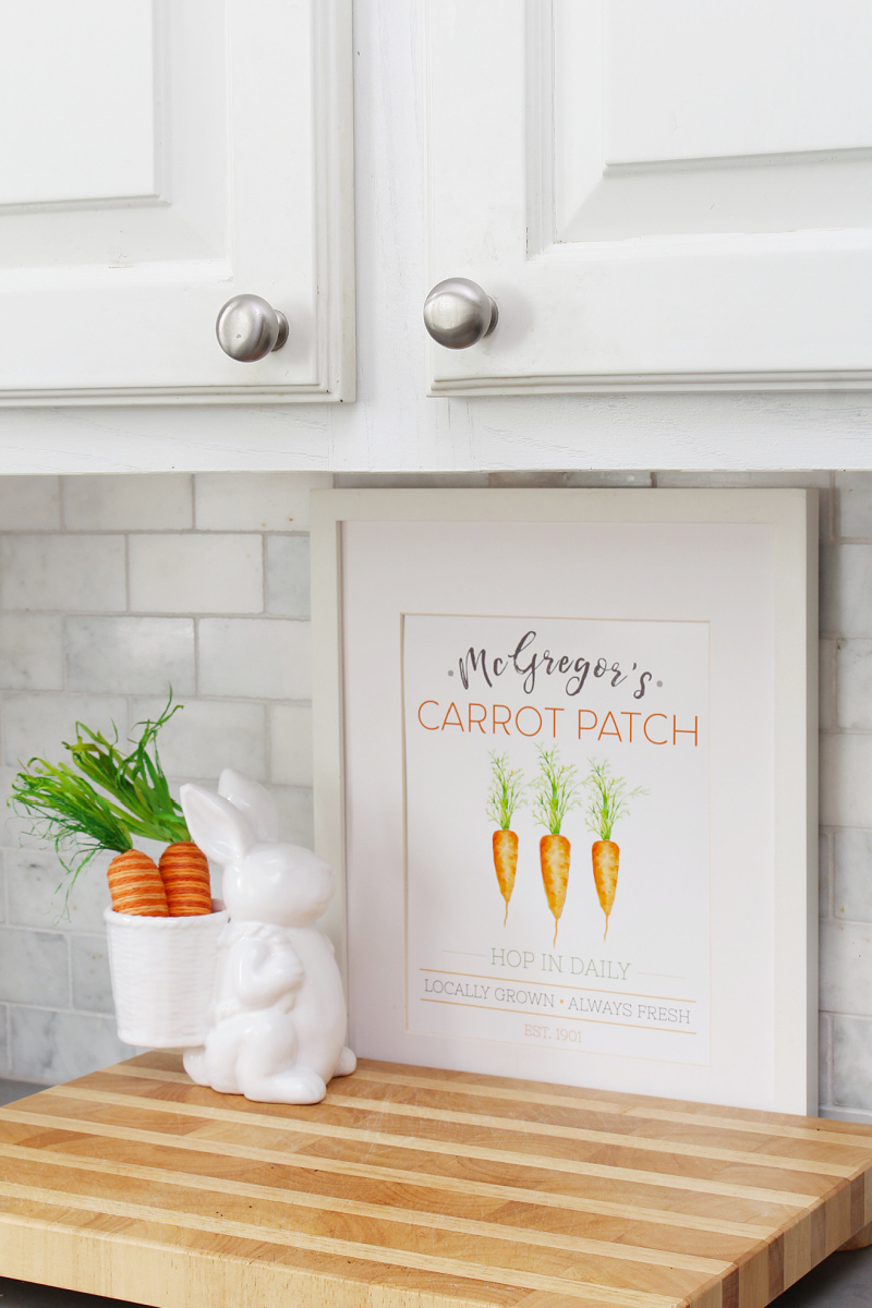 McGregor's Carrot Patch free Easter printable displayed in a frame with a white bunny and carrots.