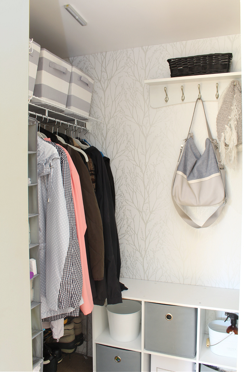 Organized and beautiful front door wardrobe with peel and stick wallpaper.