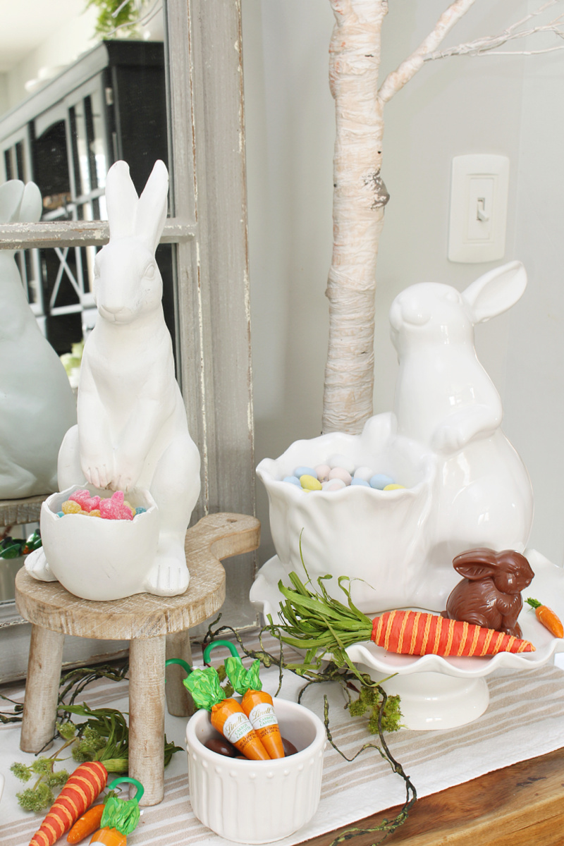 Easter candy bar with chocolates and candies displayed in white bunnies.