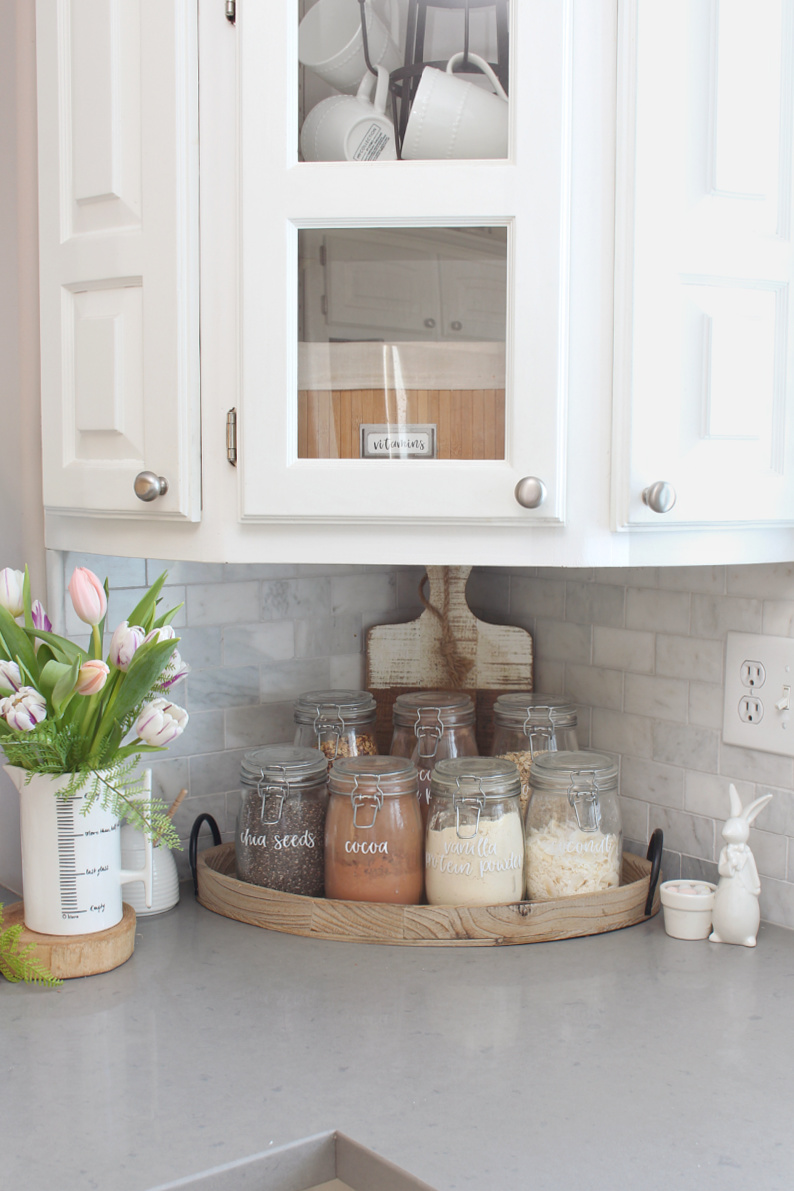 Kitchen corner with glass mason jars filled with dry goods for a smoothie bar.