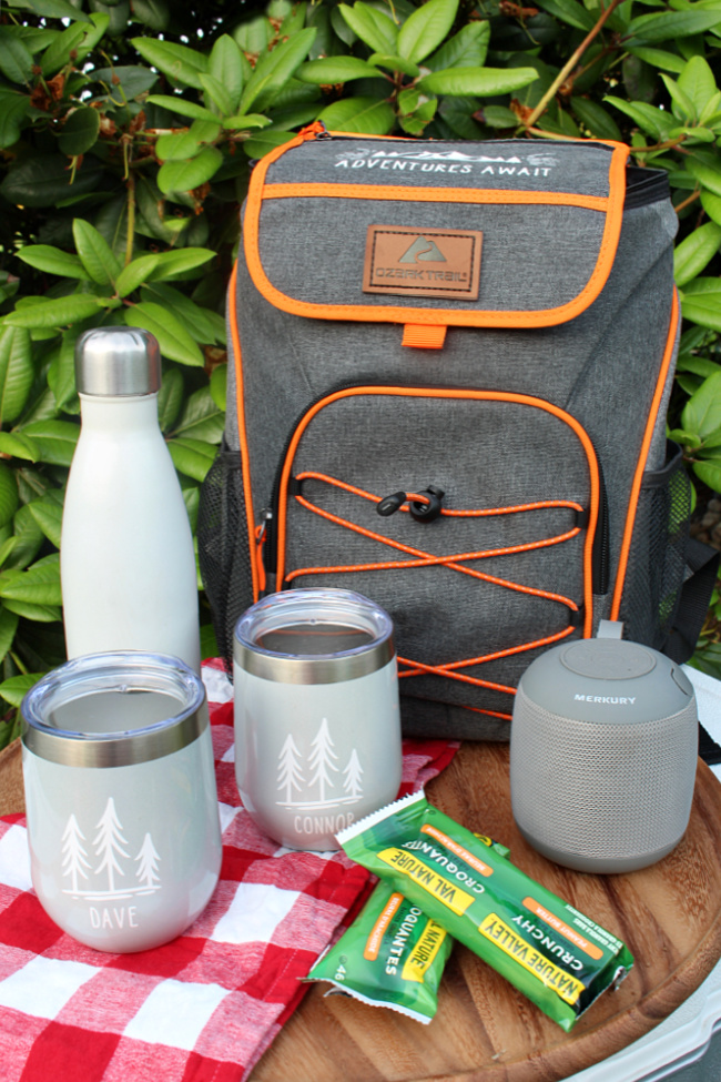 Personalized camping gift basket using an ice cooler backpack.