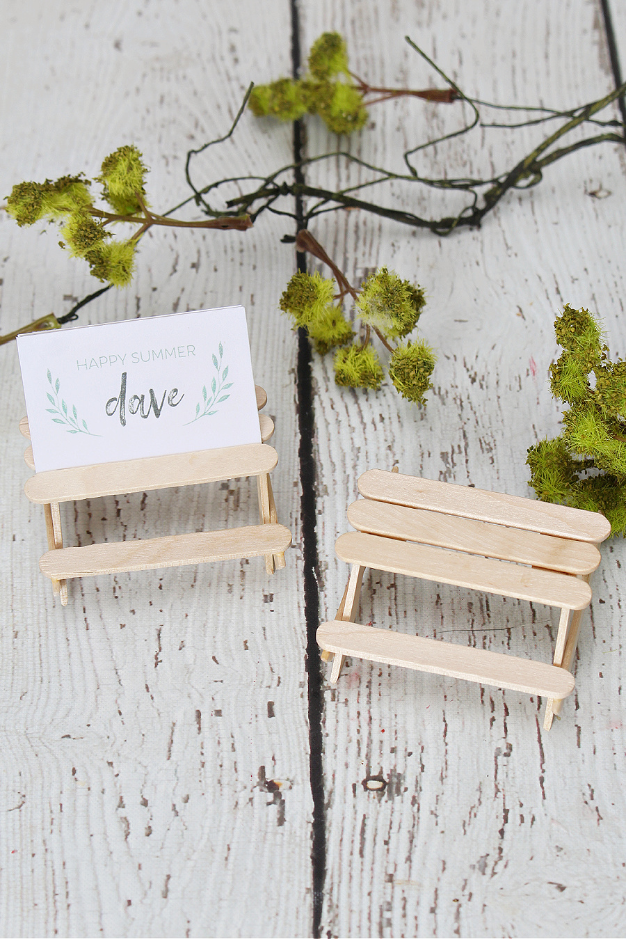 Cute popsicle stick picnic tables used as a place card holder.