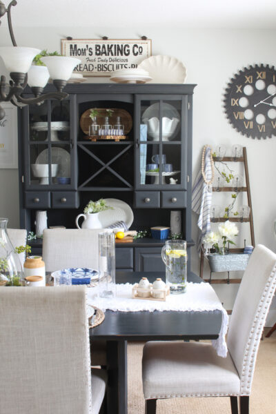 Dining room decorated for summer with pops of blue, green and yellow.