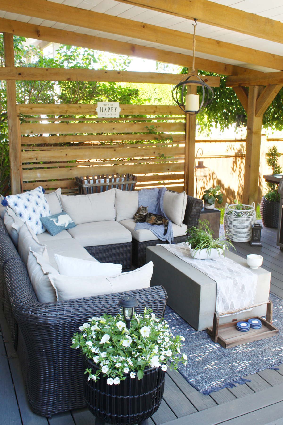 Outdoor sectional in a covered backyard patio.