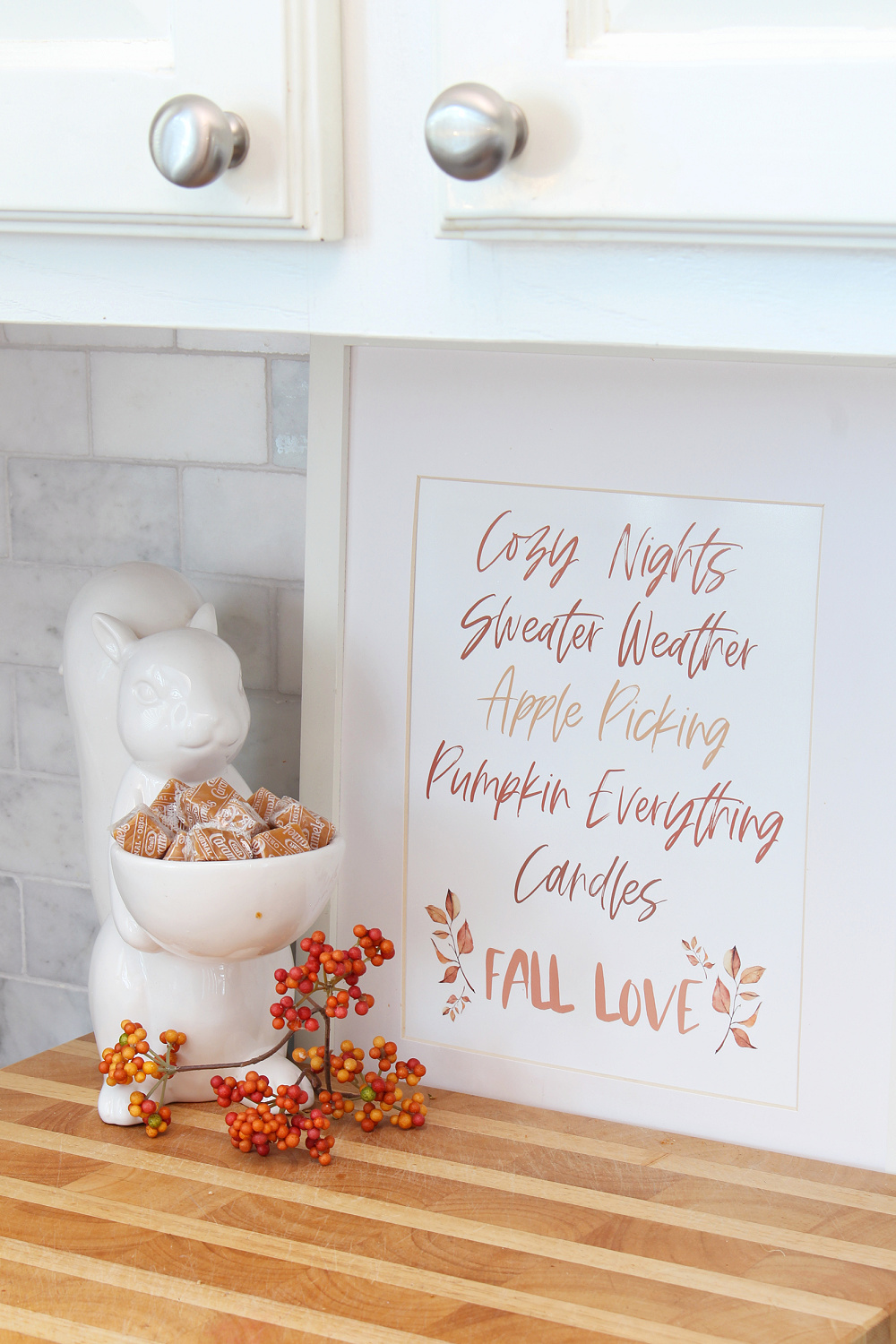 Free fall printable in a frame with ceramic squirrel.