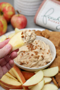 Apple dipped in cream cheese apple dip.