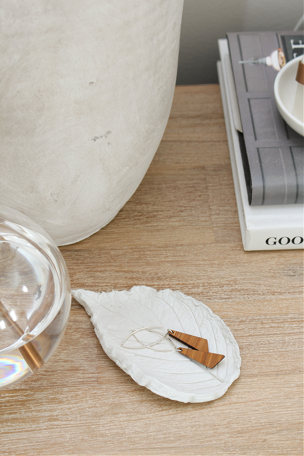 DIY air dry clay tray on a bedside table.