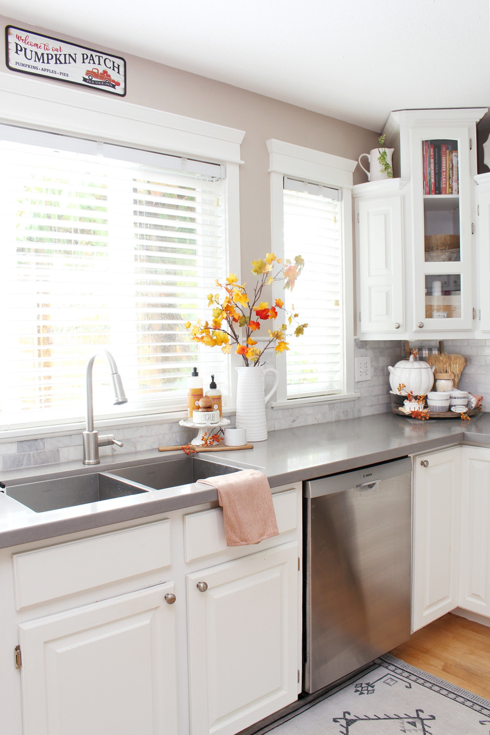 White kitchen decorated for fall with simple touches.