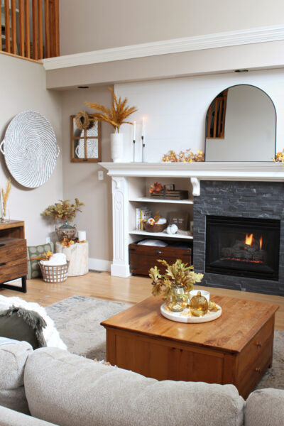 Modern fall mantel decorating ideas on a white mantel.