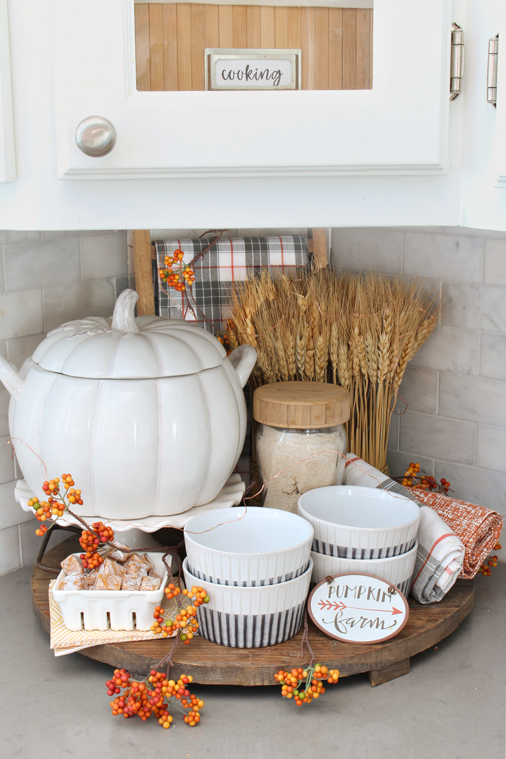 Fall vignette in a kitchen corner with a pumpkin tureen.
