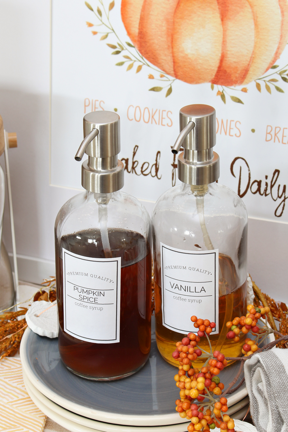 Free printable coffee syrup labels on glass dispenser bottles.