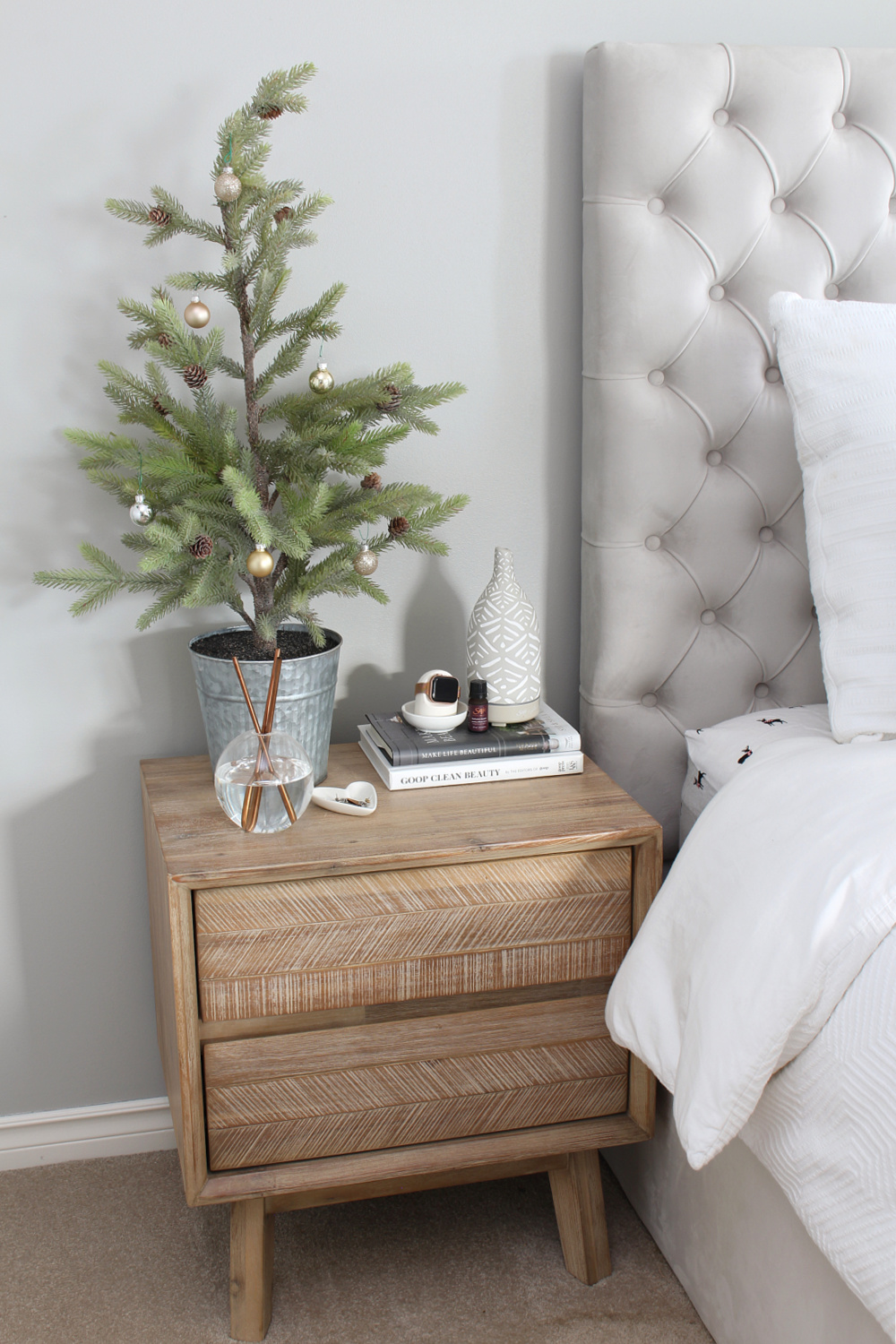 Bedside table with faux Christmas tree.