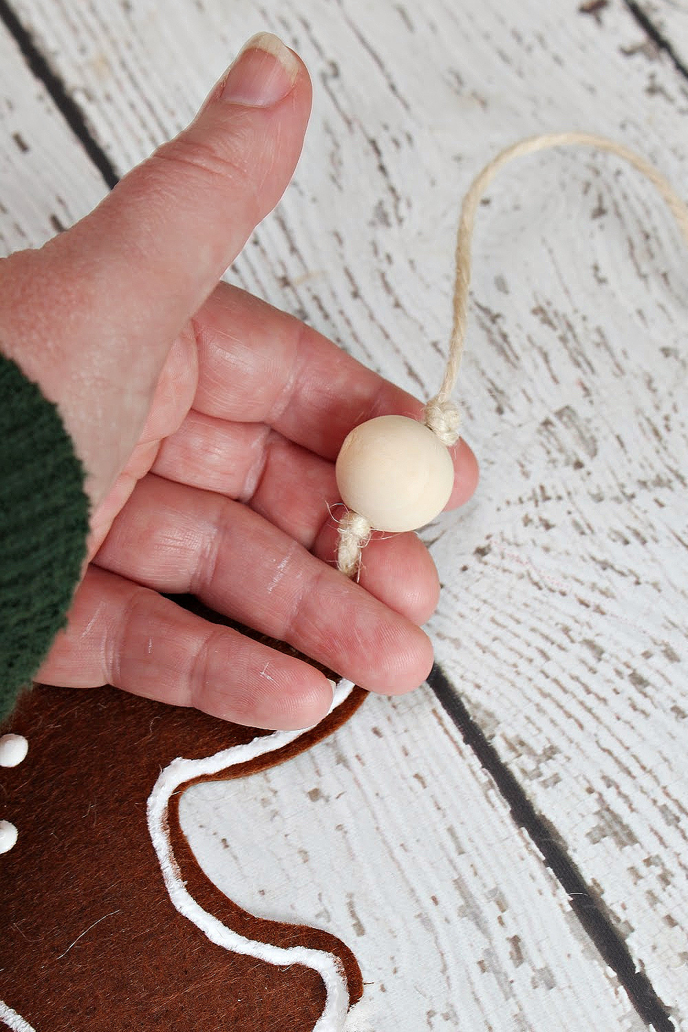 Wood bead used in a DIY felt gingerbread man garland.
