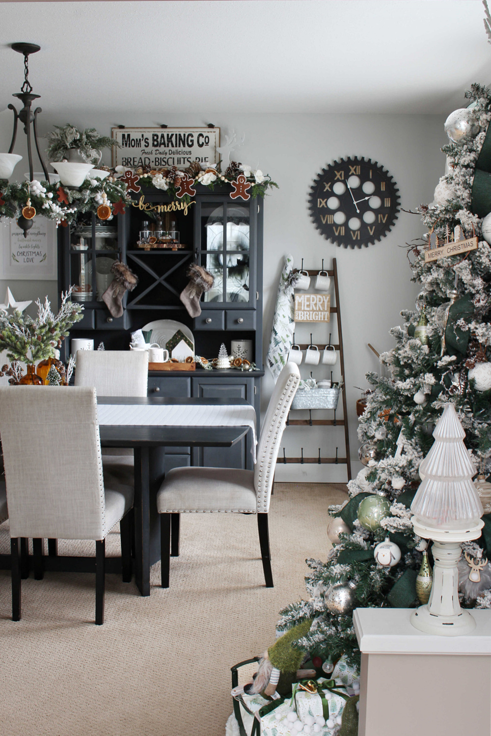 Beautiful dining room decorated for Christmas in green and white.