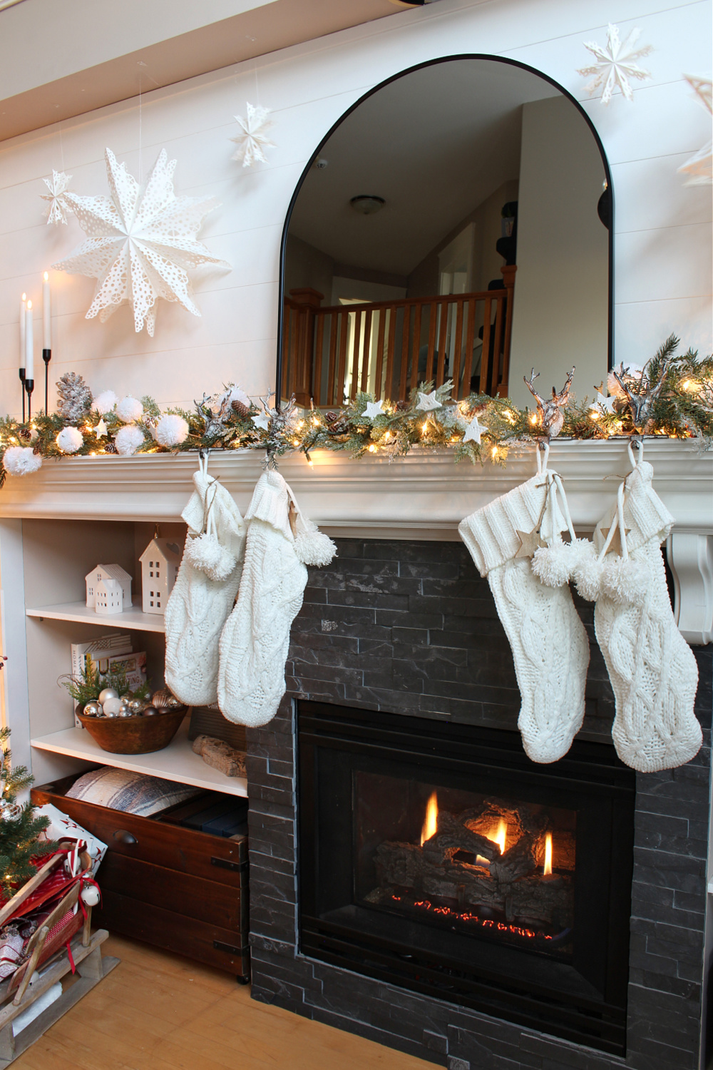 Winter wonderland Christmas mantel with white stockings.