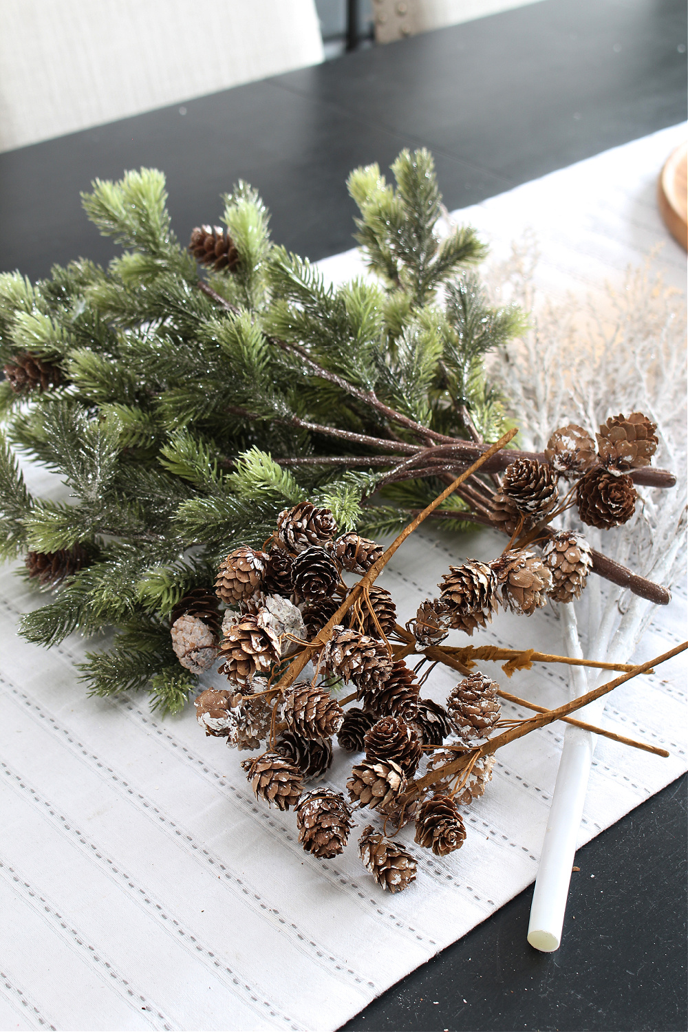 Greenery and pinecones used for a Christmas centerpiece.