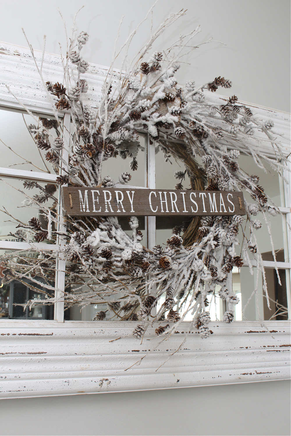 Merry Christmas snowy pinecone wreath.