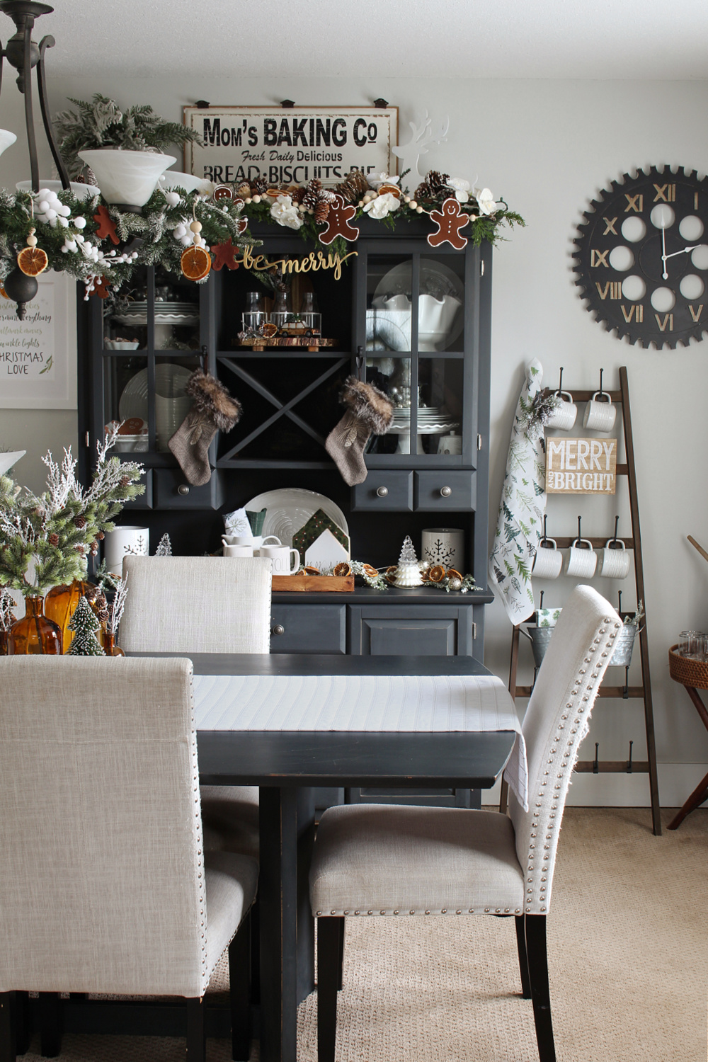 Beautiful dining room decorated for Christmas in green and white.