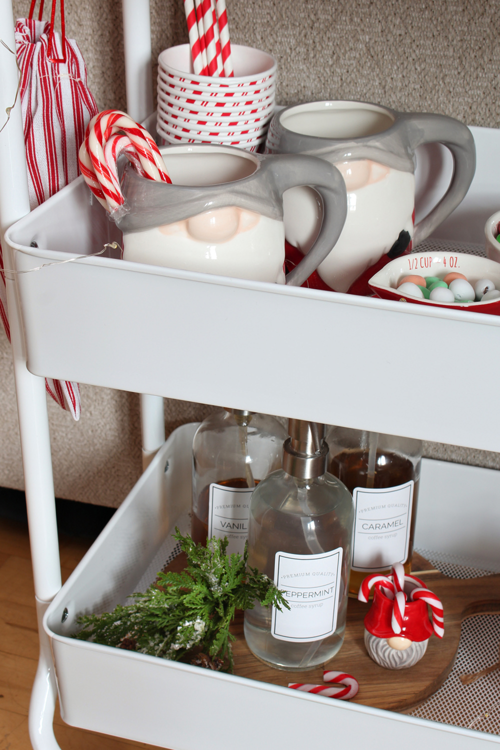 Cute hot chocolate bar cart with Christmas gnome mugs.