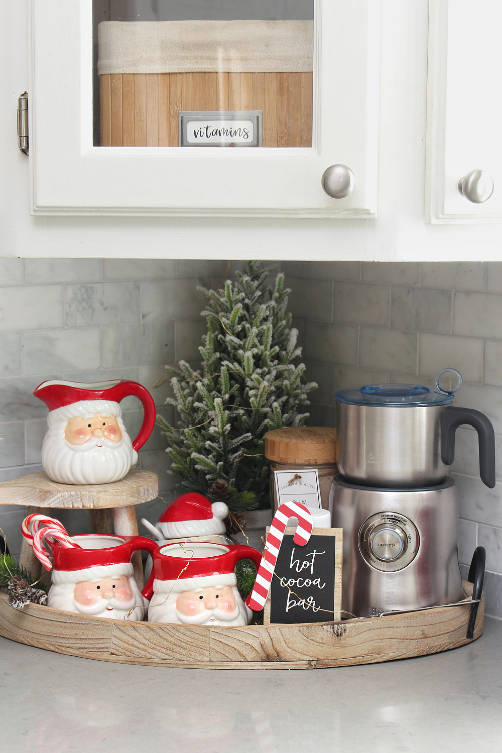 Cute Christmas hot beverage bar with Santa mugs.