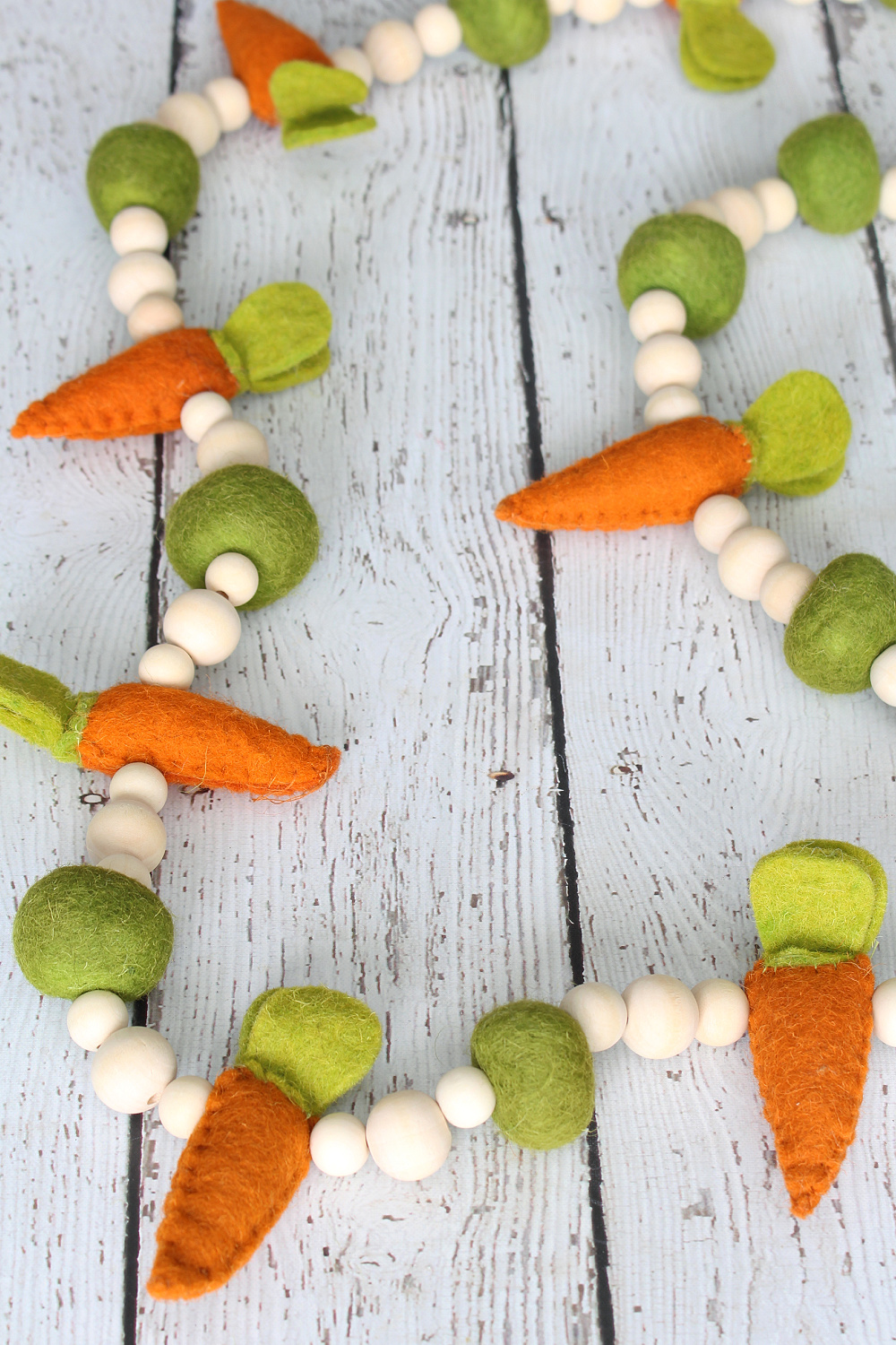 Felted carrot and wood bead Easter garland.