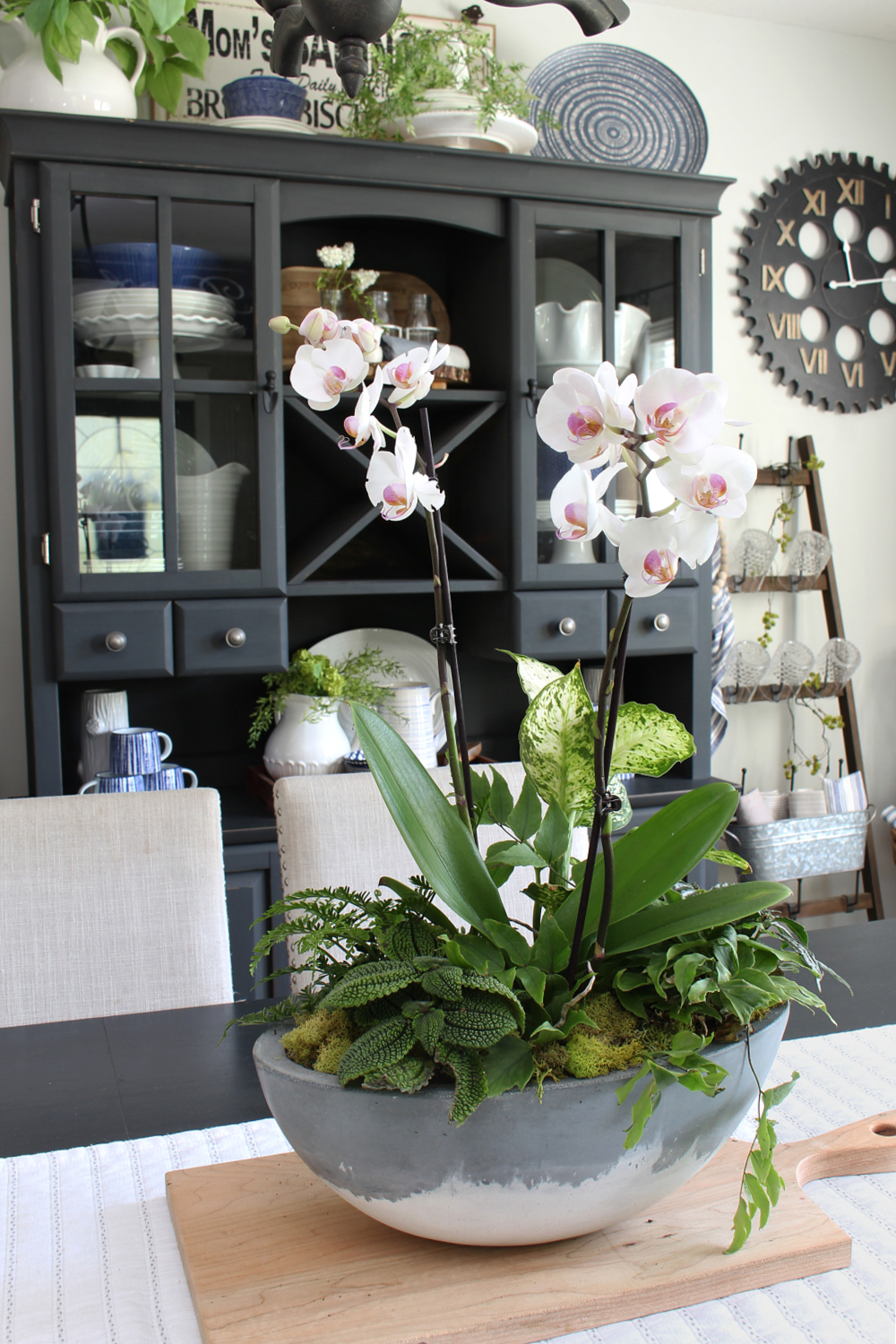 DIY orchid planter centerpiece for a summer dining room.